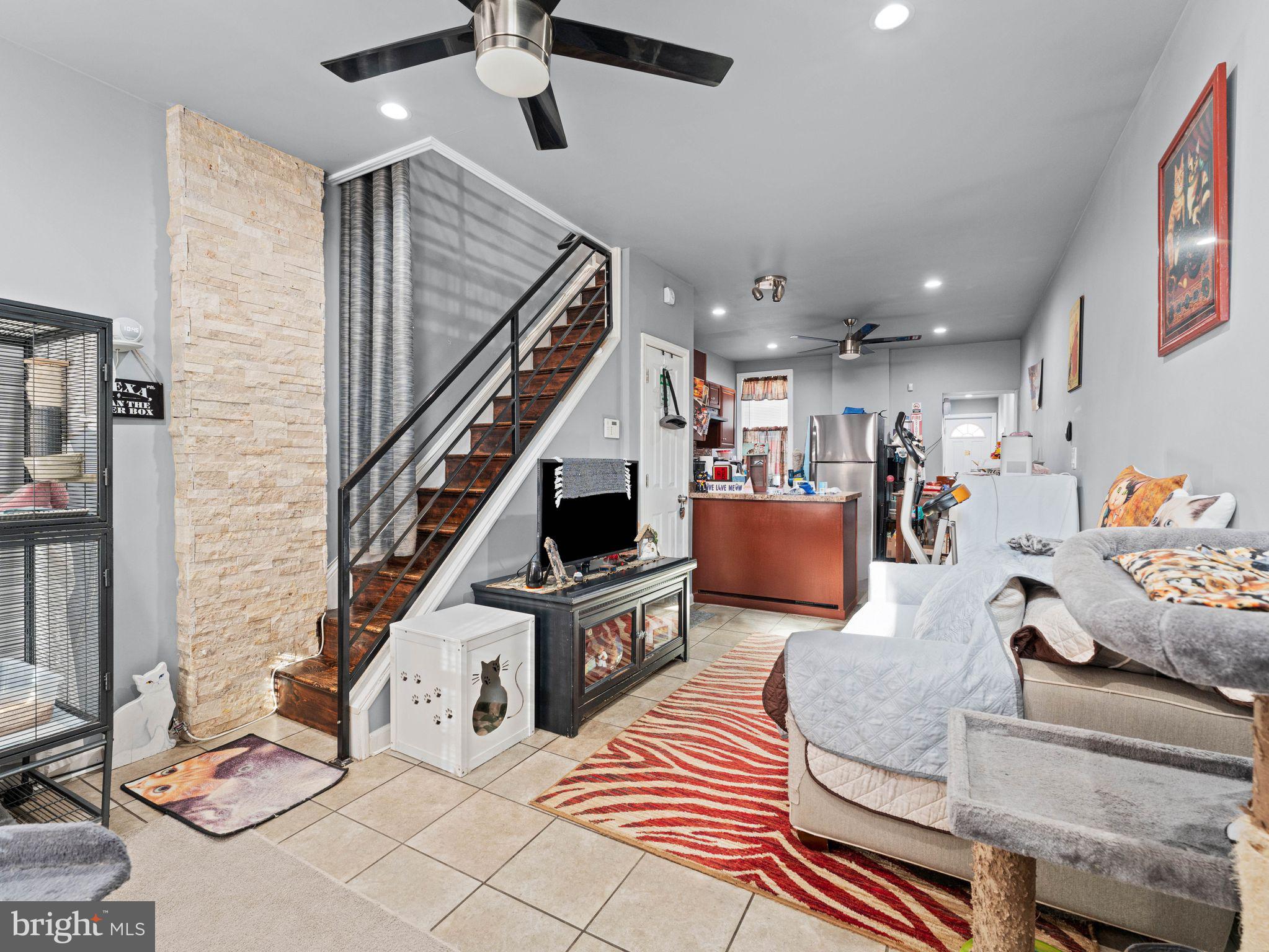 435 Mechanic Street Camden, NJ 08104 - Photo 2 of 16 a living room with furniture and a wooden floor