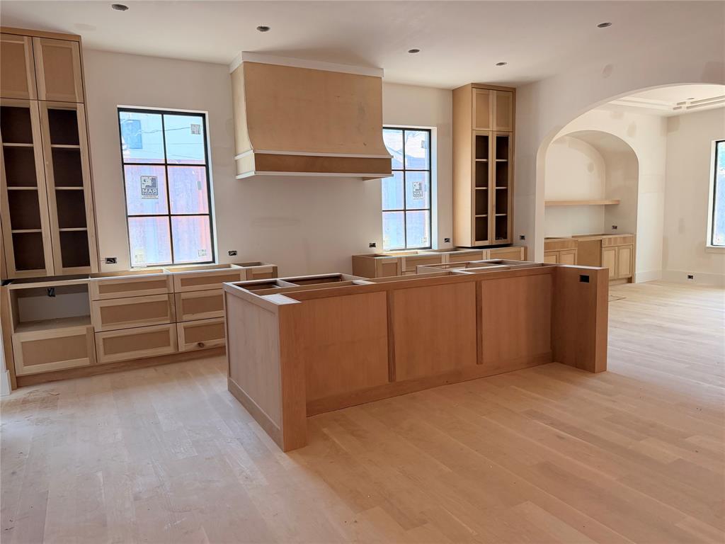 3830 Dunhaven Road Dallas, TX 75220 - Photo 8 of 21 a kitchen with cabinets a window and stainless steel appliances