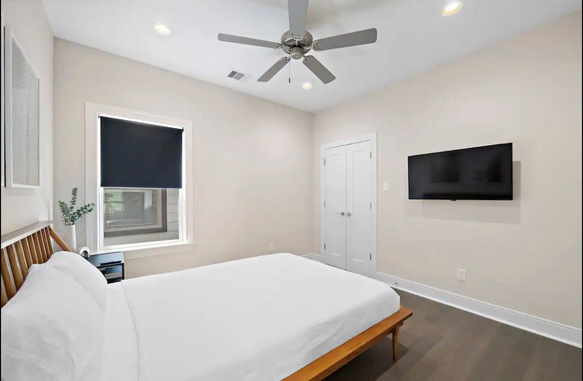 3703 Bolin Road, Unit B Houston, TX 77092 - Photo 14 of 22 a bedroom with a bed and a flat screen tv