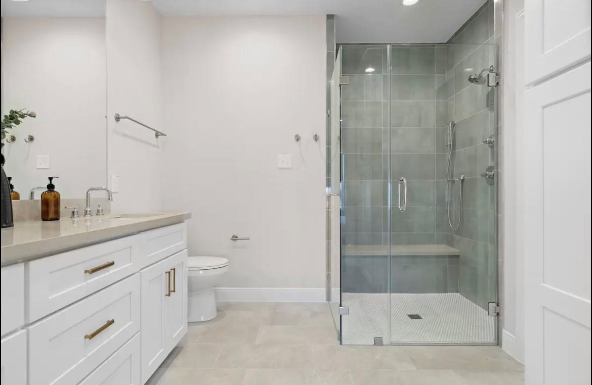 3703 Bolin Road, Unit B Houston, TX 77092 - Photo 17 of 22 a bathroom with a shower sink vanity and toilet