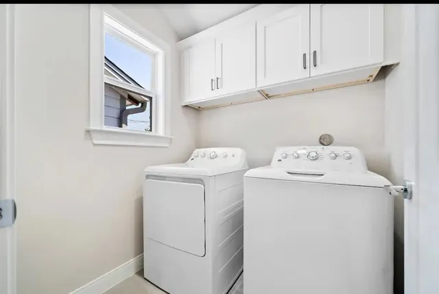 a utility room with dryer and washer