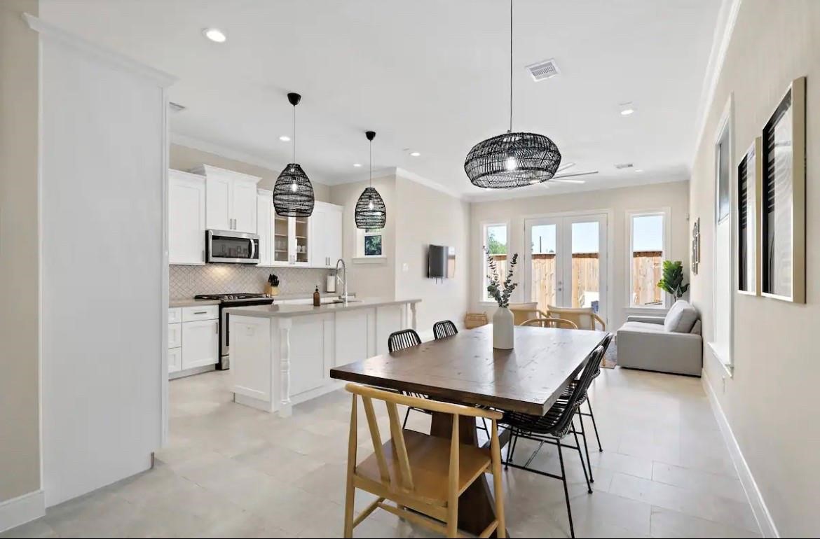 3703 Bolin Road, Unit B Houston, TX 77092 - Photo 10 of 22 a view of a dining room with furniture and wooden floor