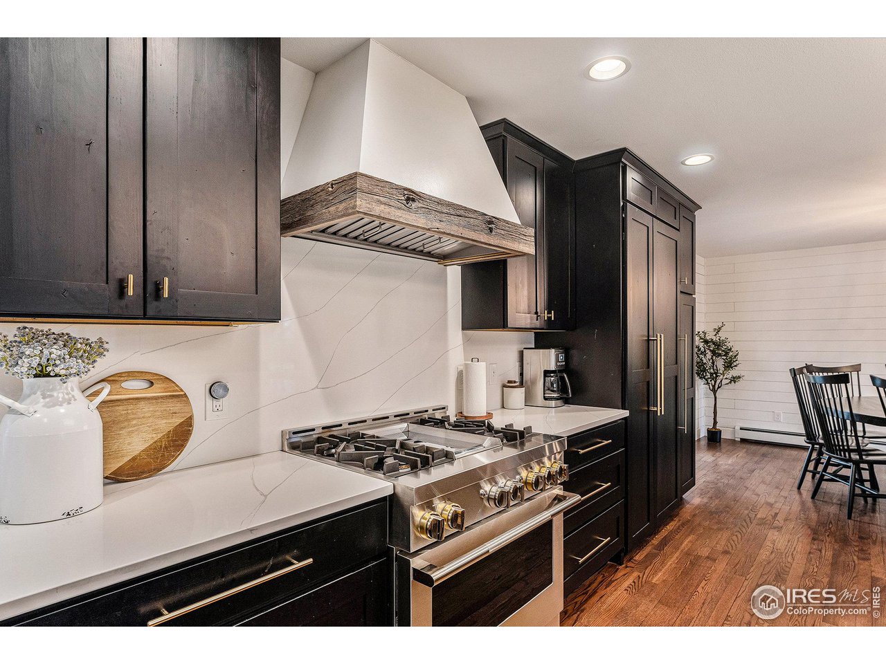 13700 Crabapple Road Golden, CO 80401 - Photo 11 of 39 a kitchen with a stove and a refrigerator