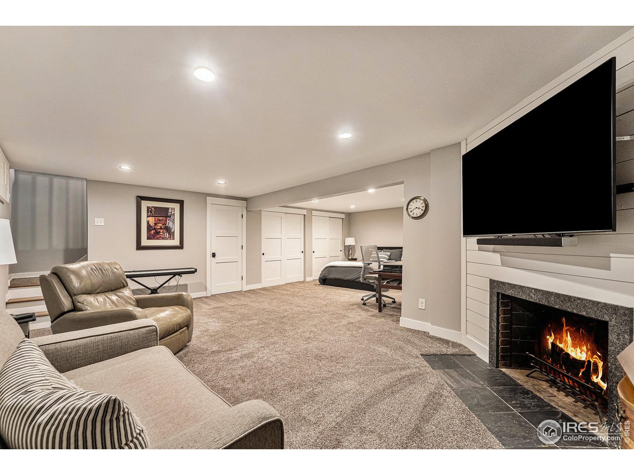 13700 Crabapple Road Golden, CO 80401 - Photo 21 of 39 a living room with furniture and a fireplace