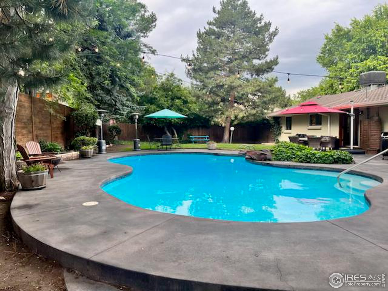 13700 Crabapple Road Golden, CO 80401 - Photo 29 of 39 a view of a swimming pool with lounge chair