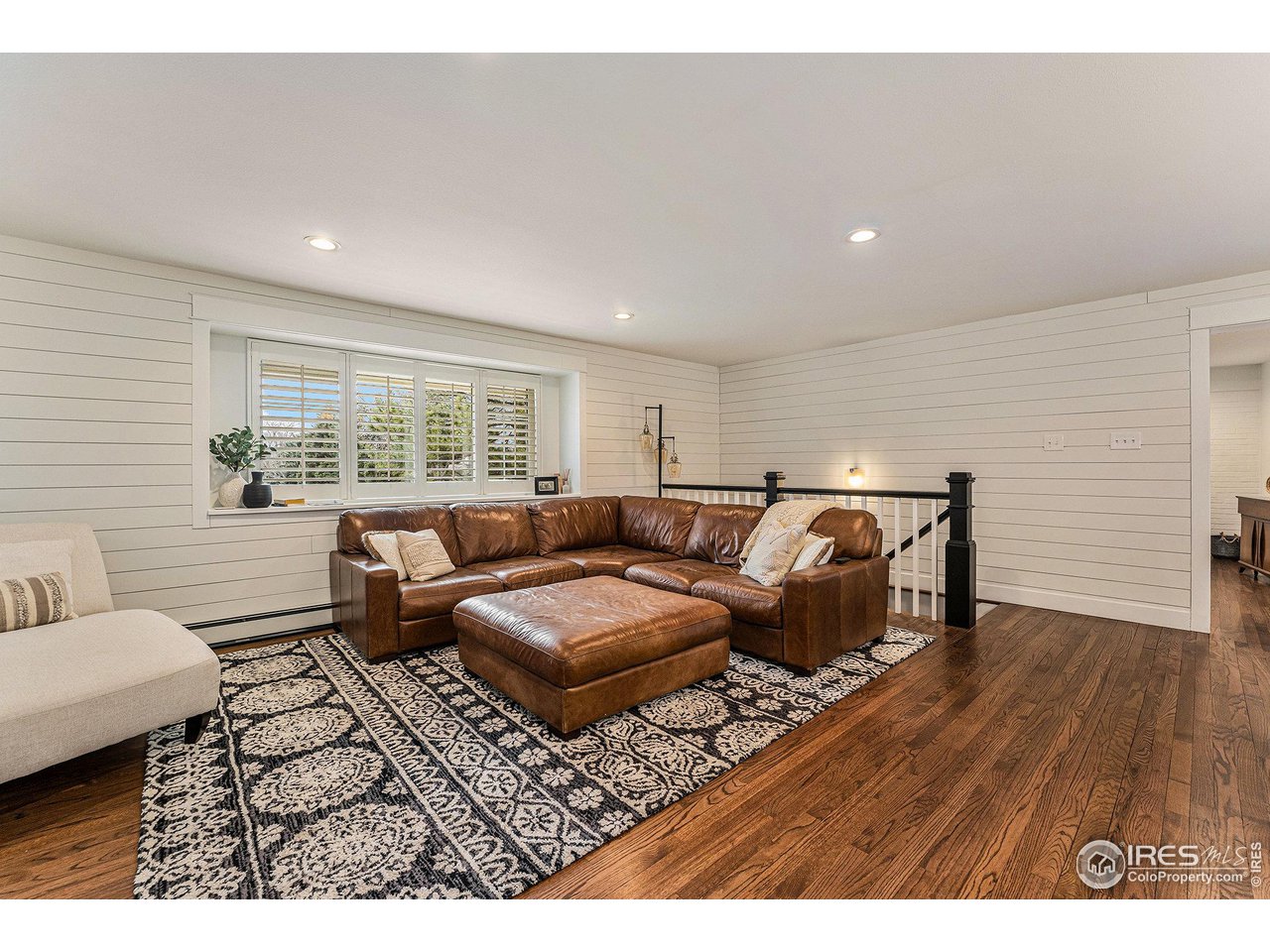 13700 Crabapple Road Golden, CO 80401 - Photo 6 of 39 a living room with furniture and wooden floor