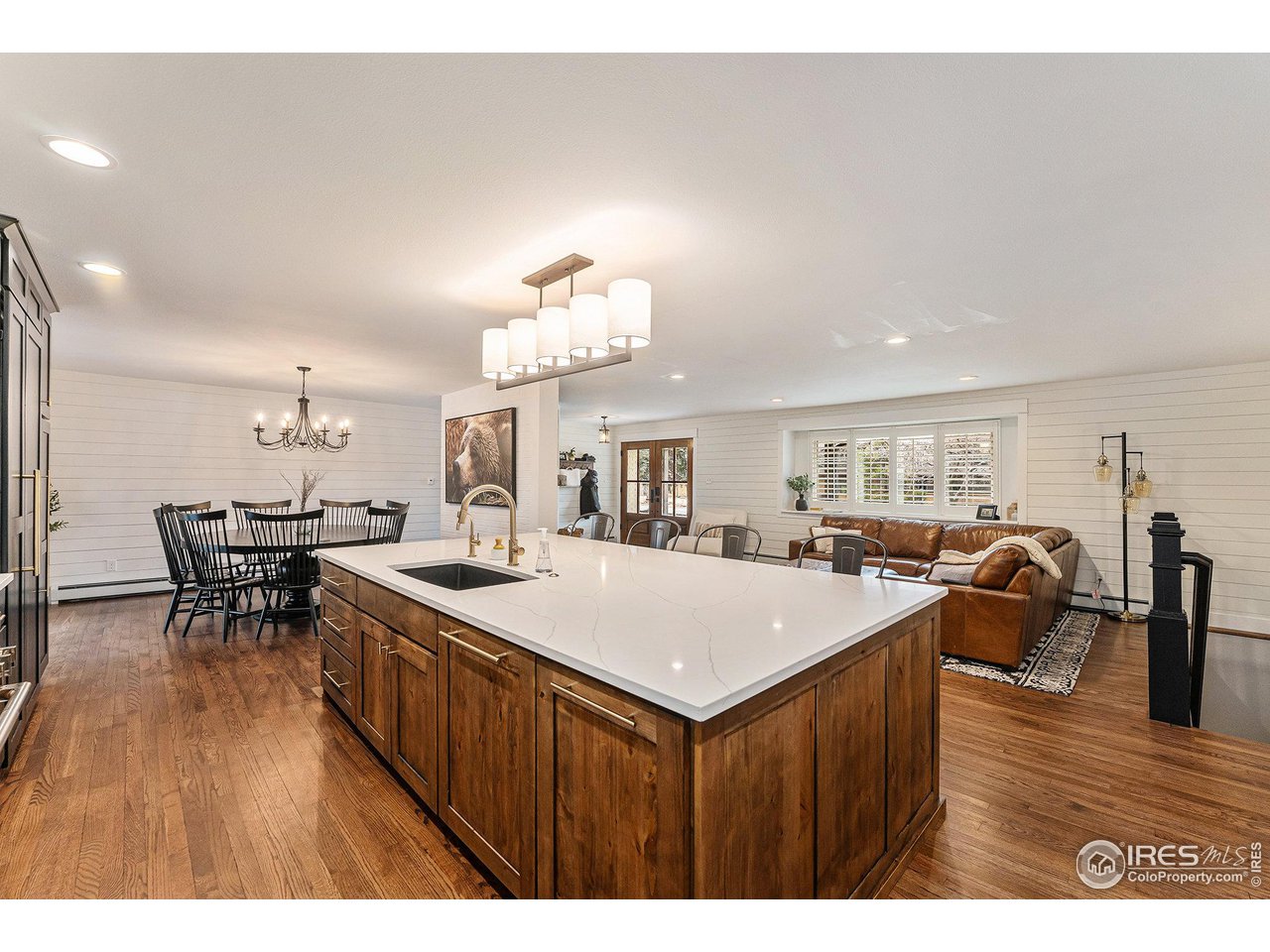 13700 Crabapple Road Golden, CO 80401 - Photo 7 of 39 a view of a dining room with furniture and wooden floor