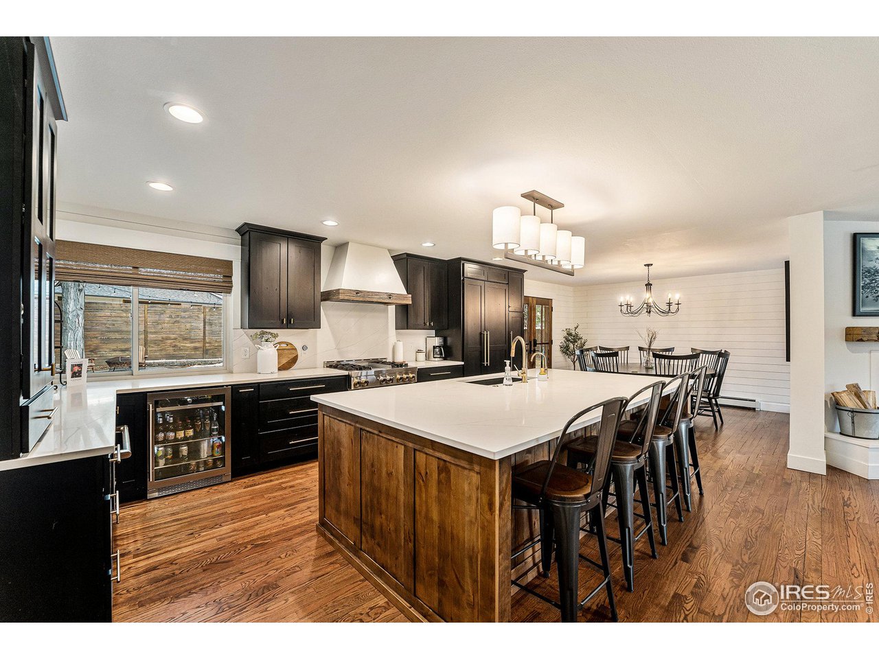 13700 Crabapple Road Golden, CO 80401 - Photo 8 of 39 a large kitchen with a table and chairs