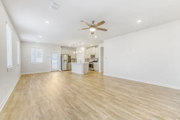 a view of an empty room with a window