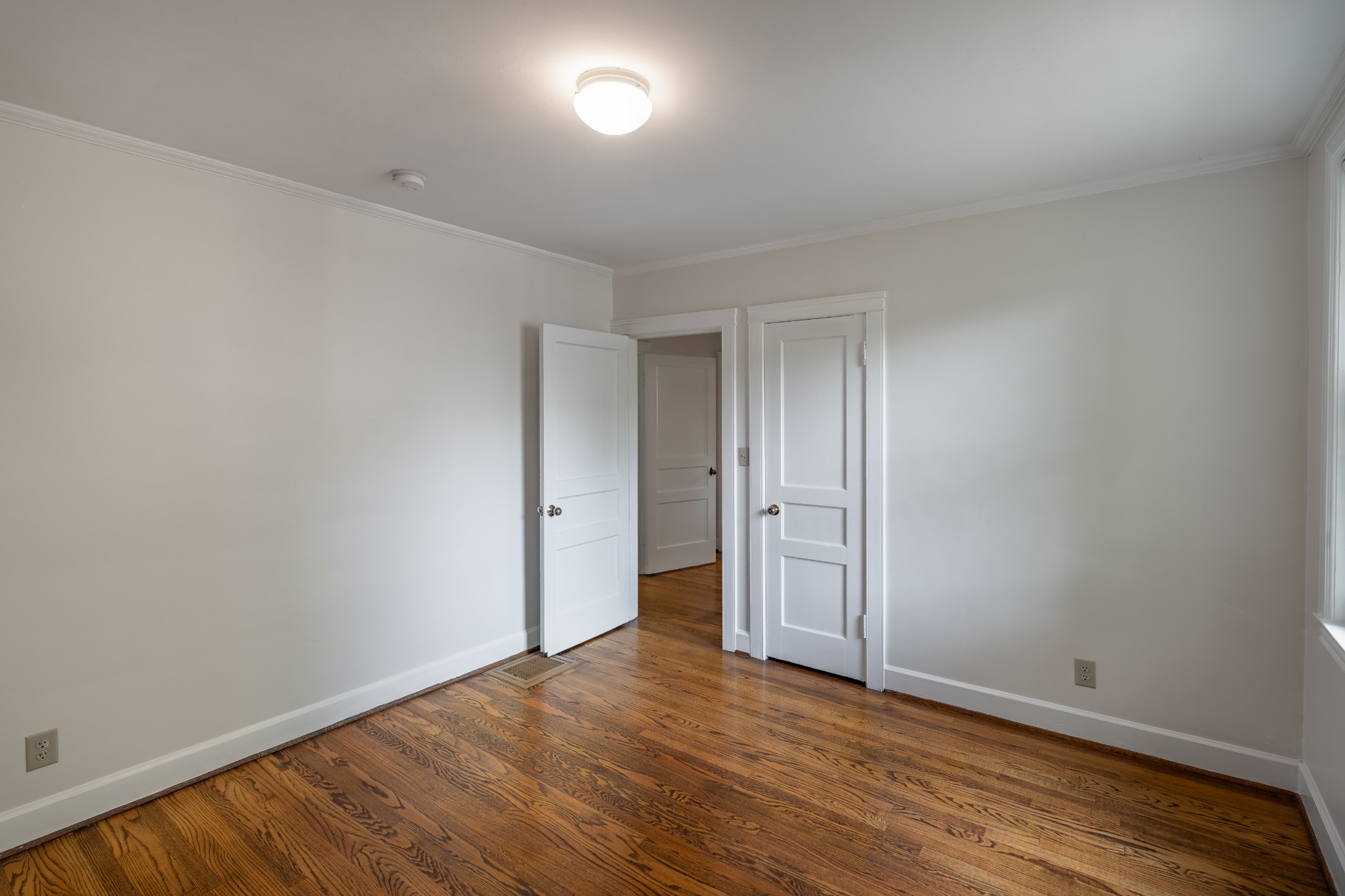 3508 Robin Road Nashville, TN 37204 - Photo 11 of 32 a view of an empty room with wooden floor