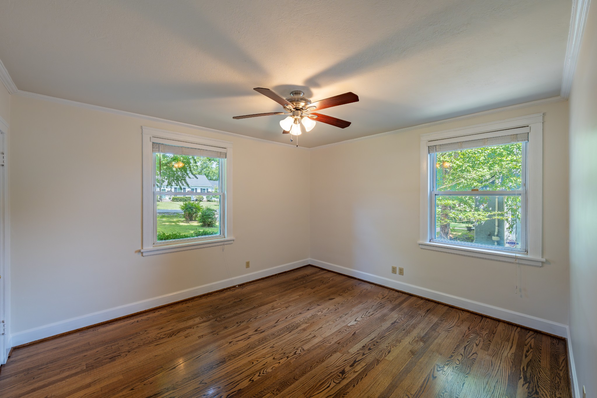 3508 Robin Road Nashville, TN 37204 - Photo 12 of 32 a view of an empty room with wooden floor and a window