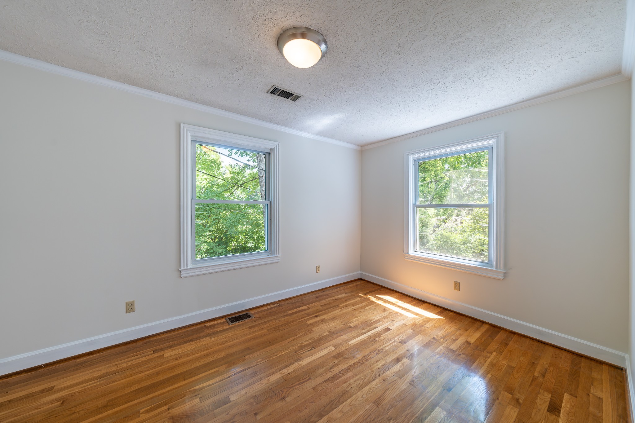 3508 Robin Road Nashville, TN 37204 - Photo 21 of 32 a view of an empty room with wooden floor and a window