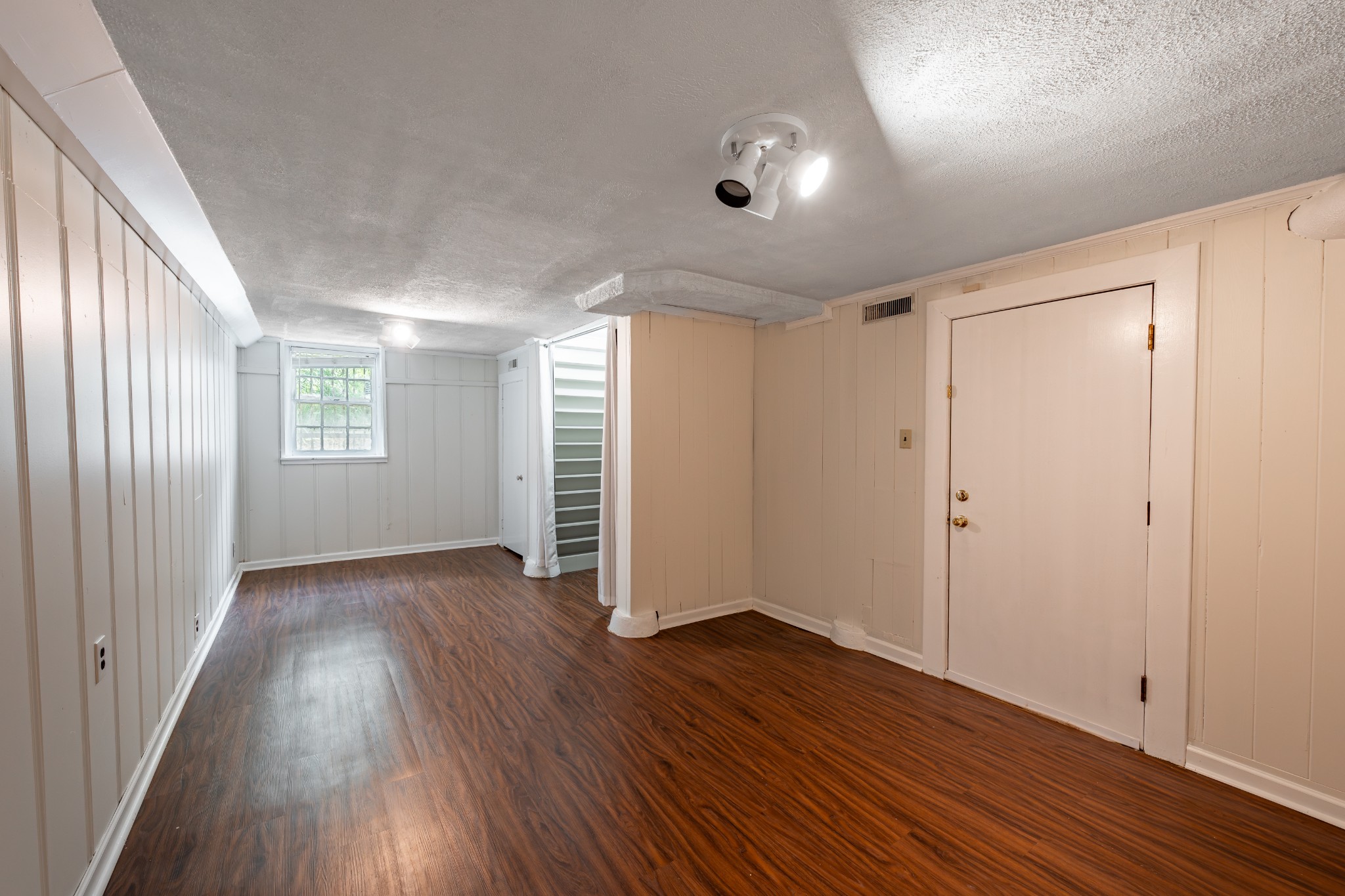 3508 Robin Road Nashville, TN 37204 - Photo 25 of 32 an empty room with wooden floor and windows