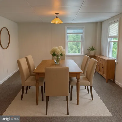 a dining room with furniture and window