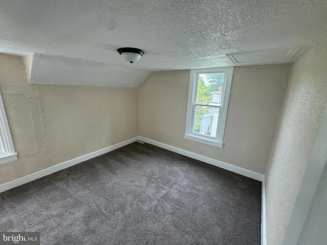 a view of a room that has a window in it