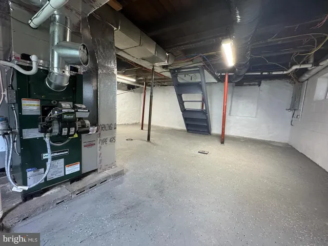 a view of an empty room with windows