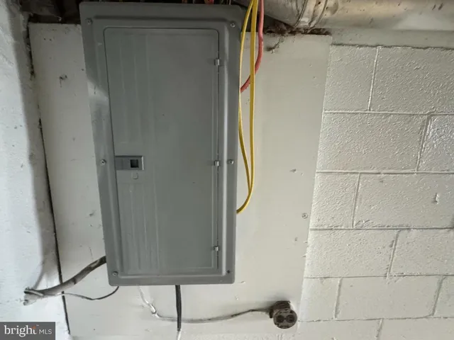 a view of an empty room with a mirror