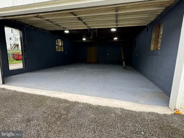 an empty room with a ceiling fan