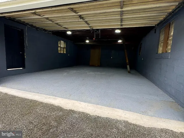 a view of a house with a yard and garage