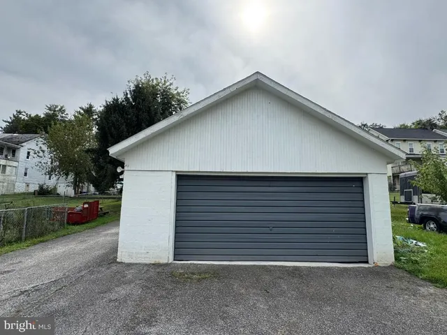 an aerial view of house with yard