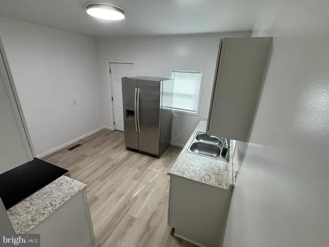 a room with sink and mirror