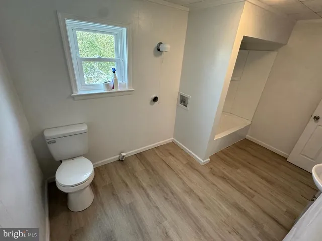 a bathroom with a toilet and a sink