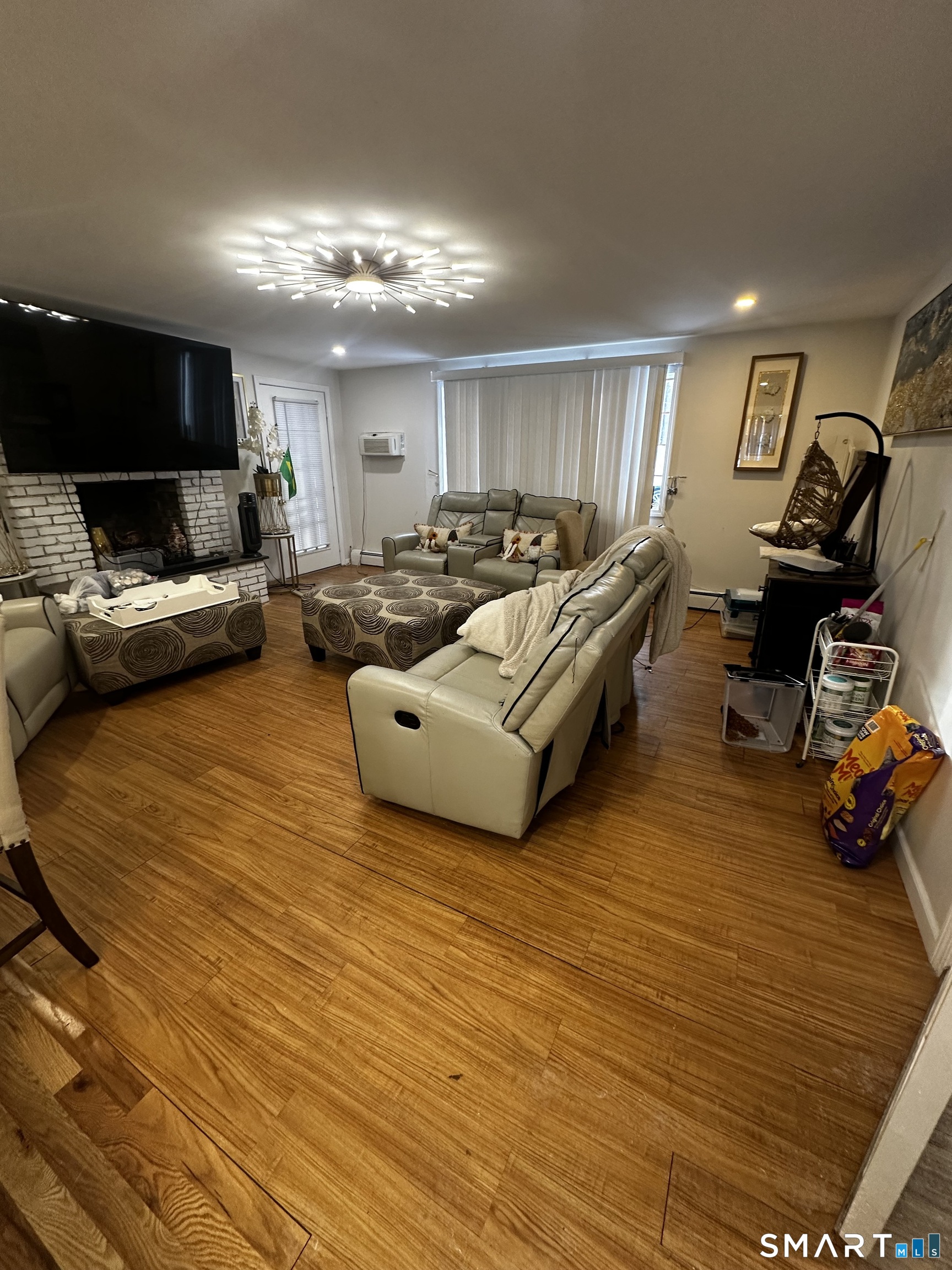 249 Wheeler Road Monroe, CT 06468 - Photo 15 of 39 a living room with furniture and a flat screen tv