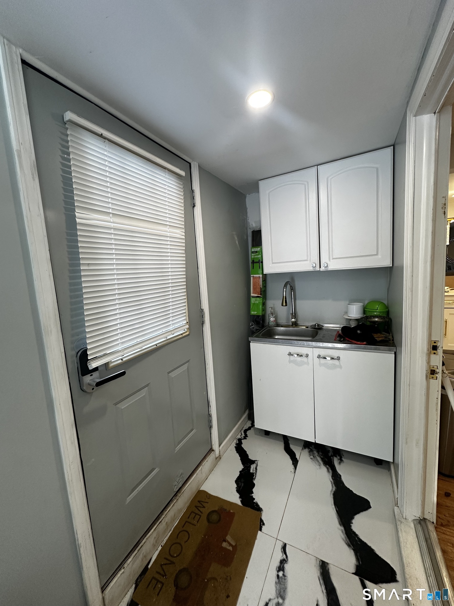 249 Wheeler Road Monroe, CT 06468 - Photo 17 of 39 a room with white cabinets and a window