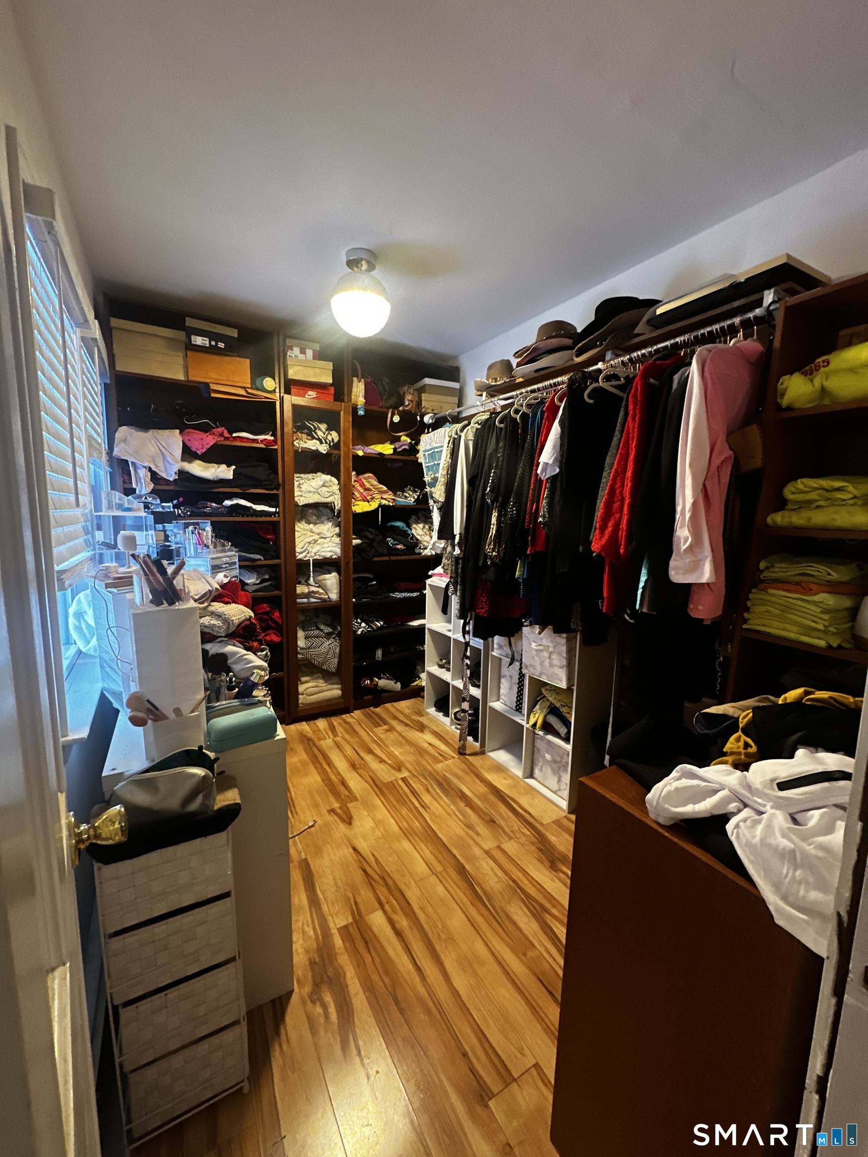249 Wheeler Road Monroe, CT 06468 - Photo 21 of 39 a view of walk in closet with clothes and shoes