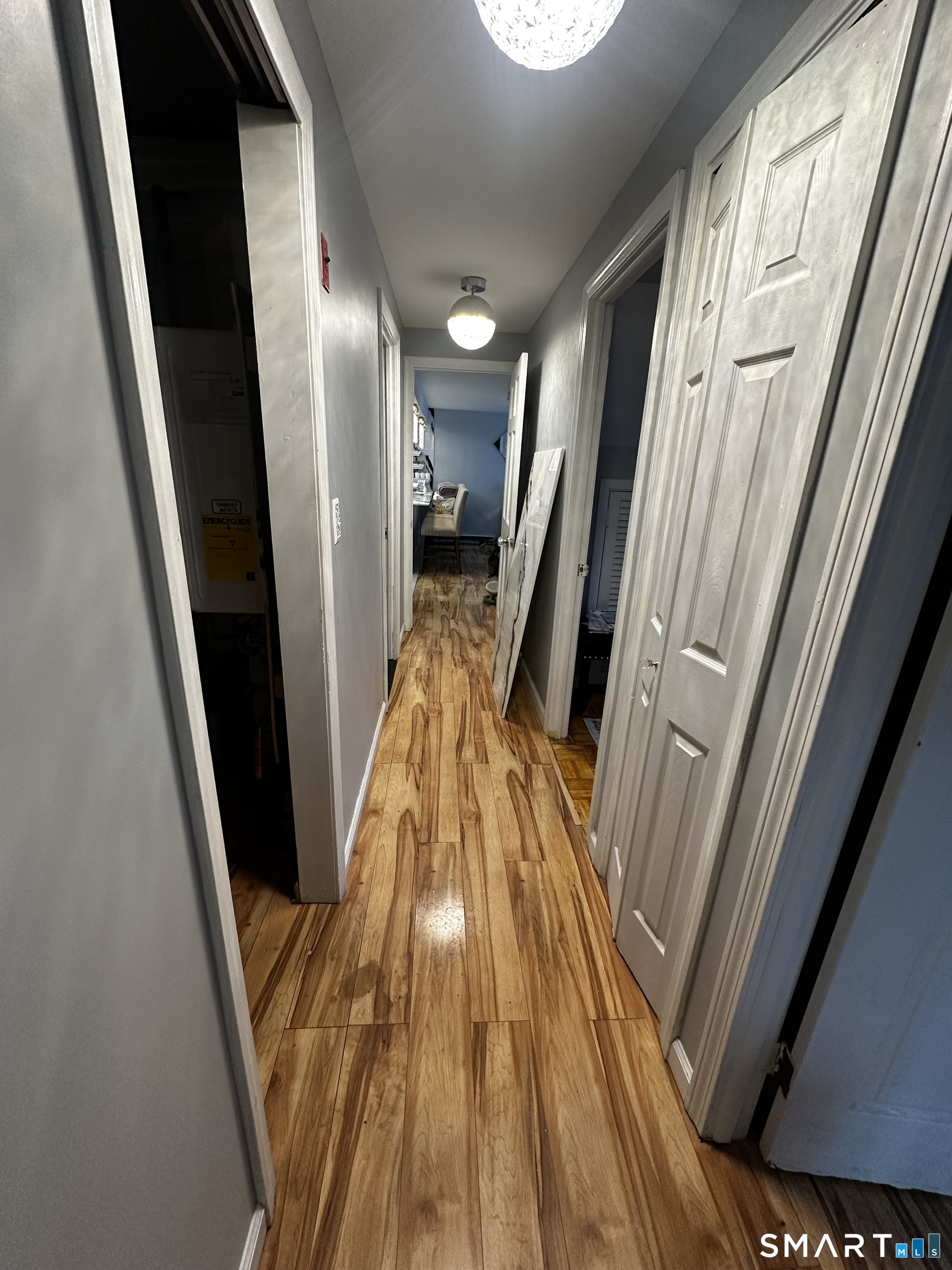 249 Wheeler Road Monroe, CT 06468 - Photo 27 of 39 a view of a hallway with wooden floor and stairs
