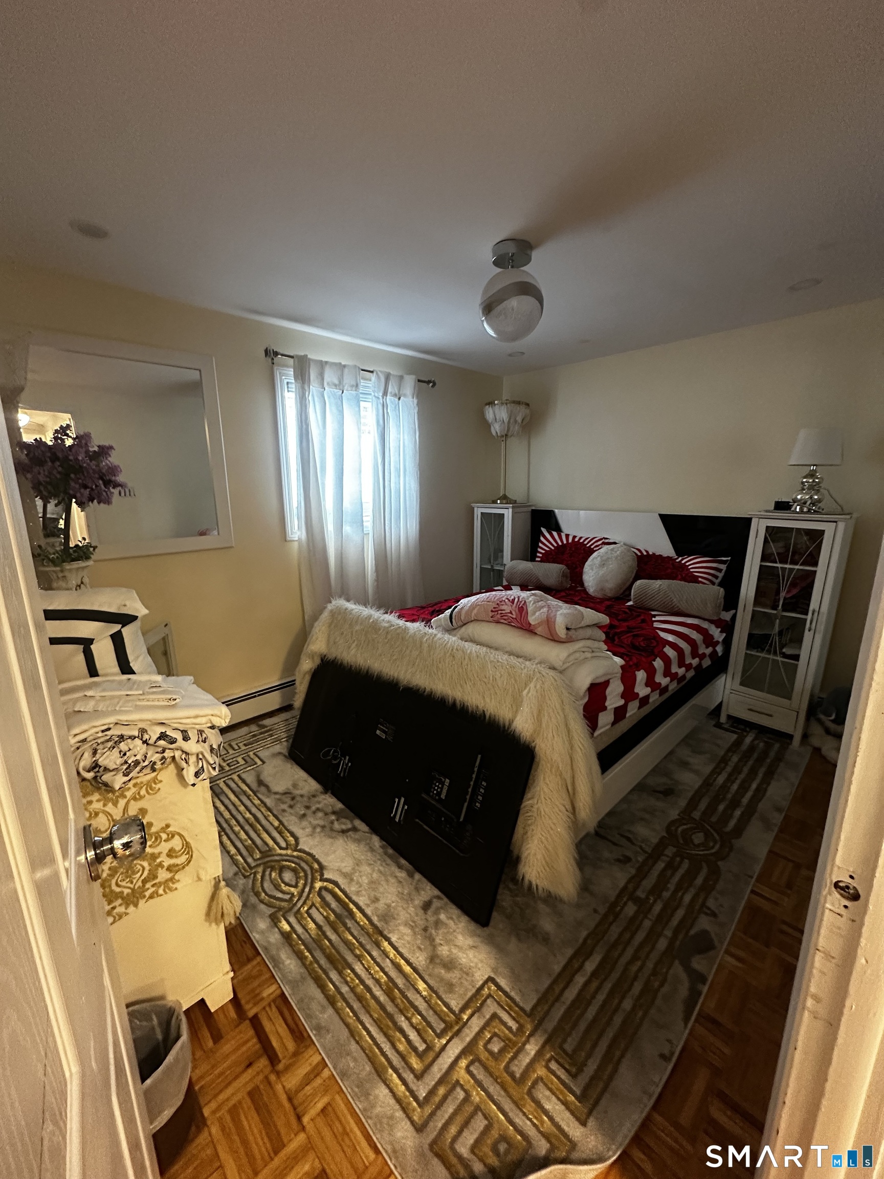 249 Wheeler Road Monroe, CT 06468 - Photo 28 of 39 a bedroom with a bed and wooden floor