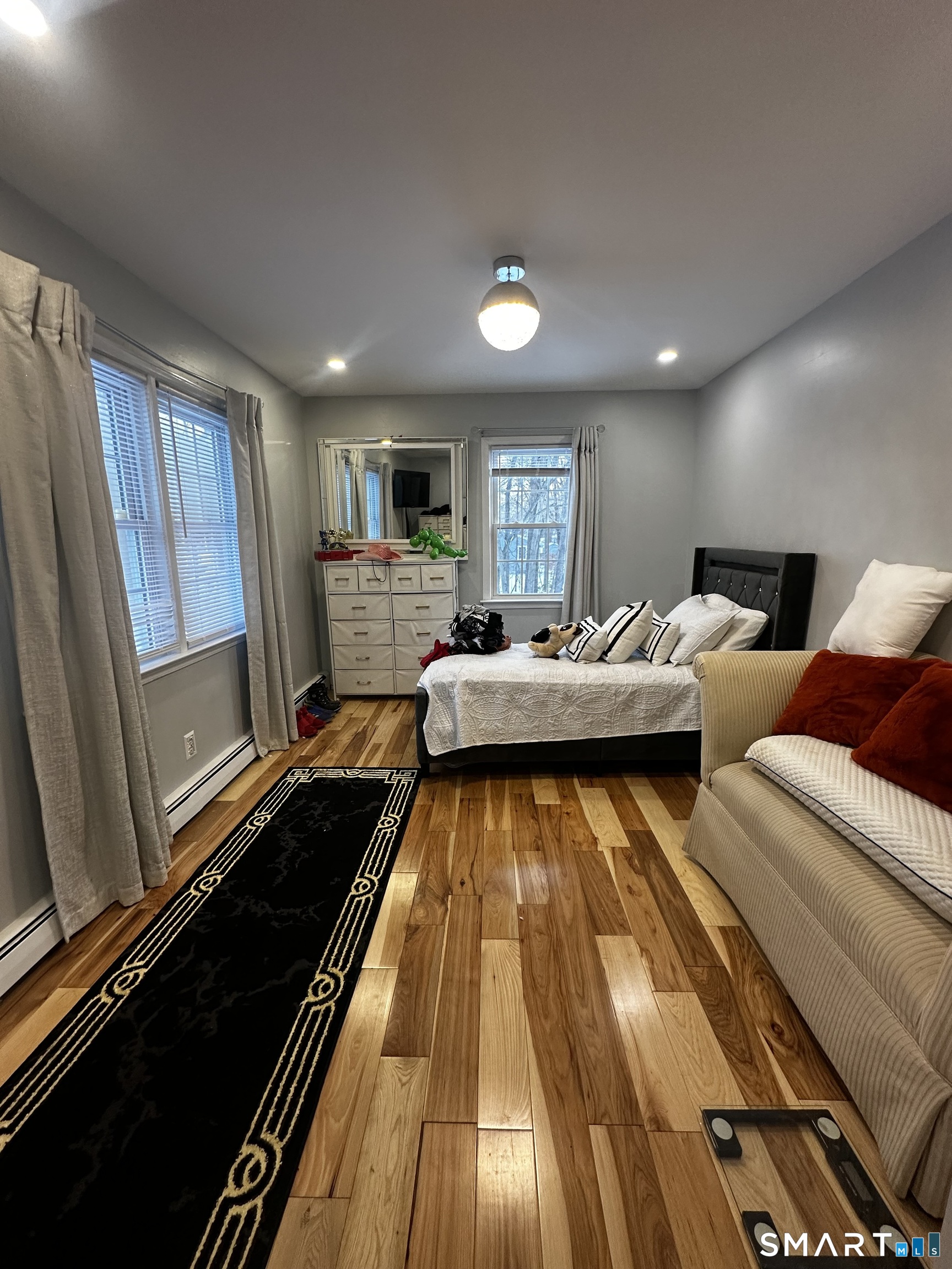 249 Wheeler Road Monroe, CT 06468 - Photo 28 of 39 a living room with furniture and a rug