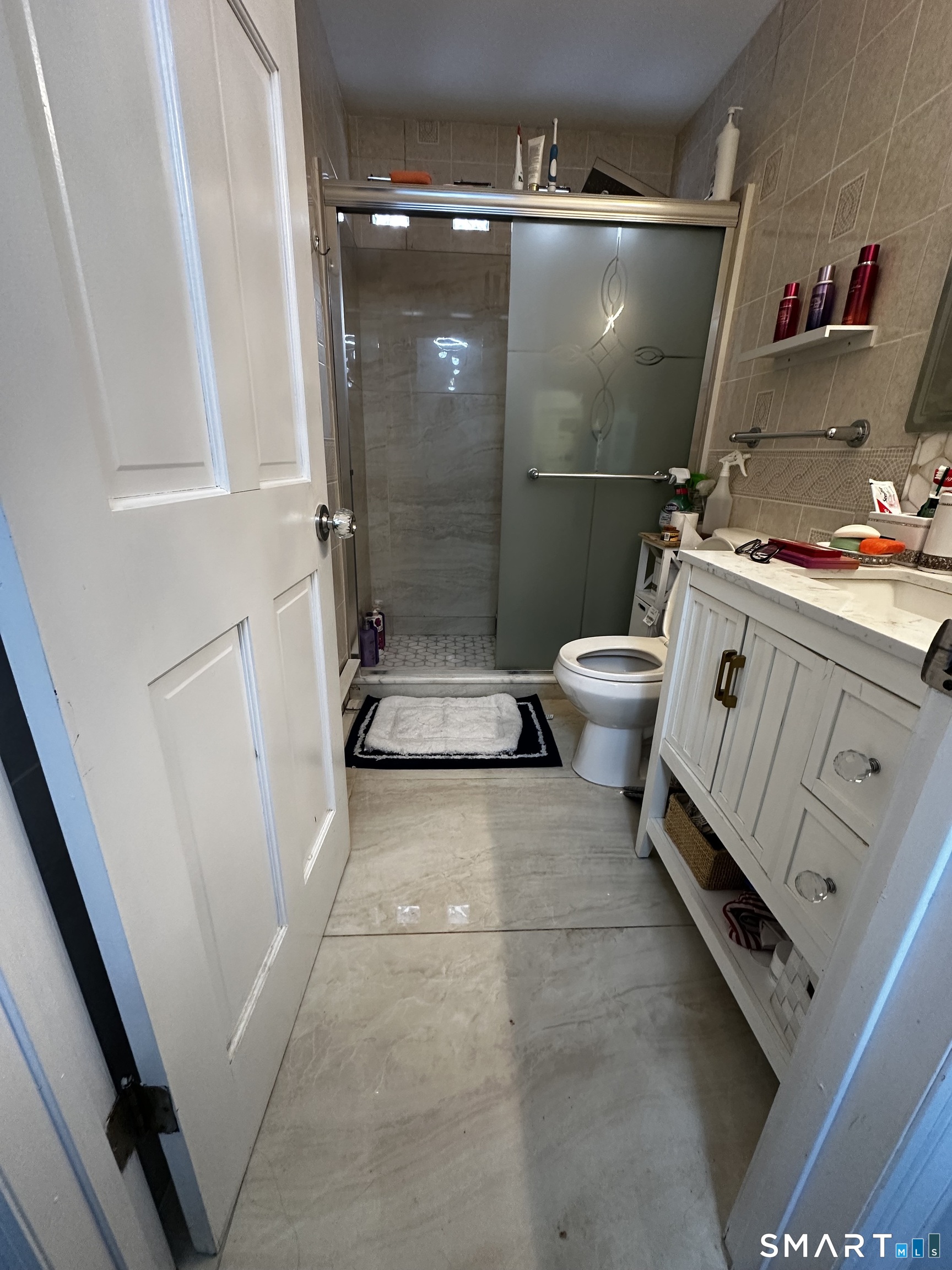 249 Wheeler Road Monroe, CT 06468 - Photo 31 of 39 a bathroom with a toilet a sink and a shower