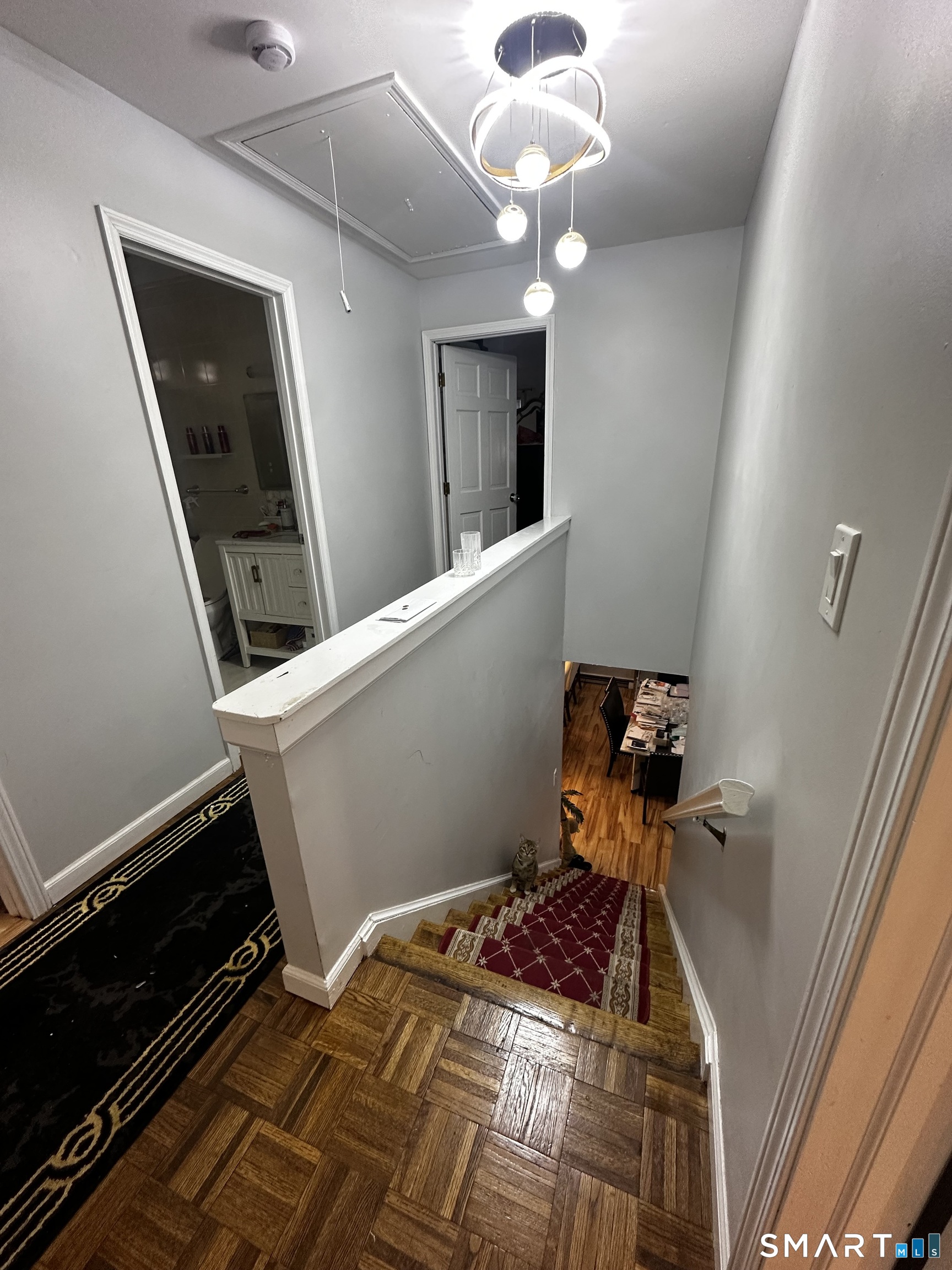 249 Wheeler Road Monroe, CT 06468 - Photo 37 of 39 a bedroom with a bed and a chandelier