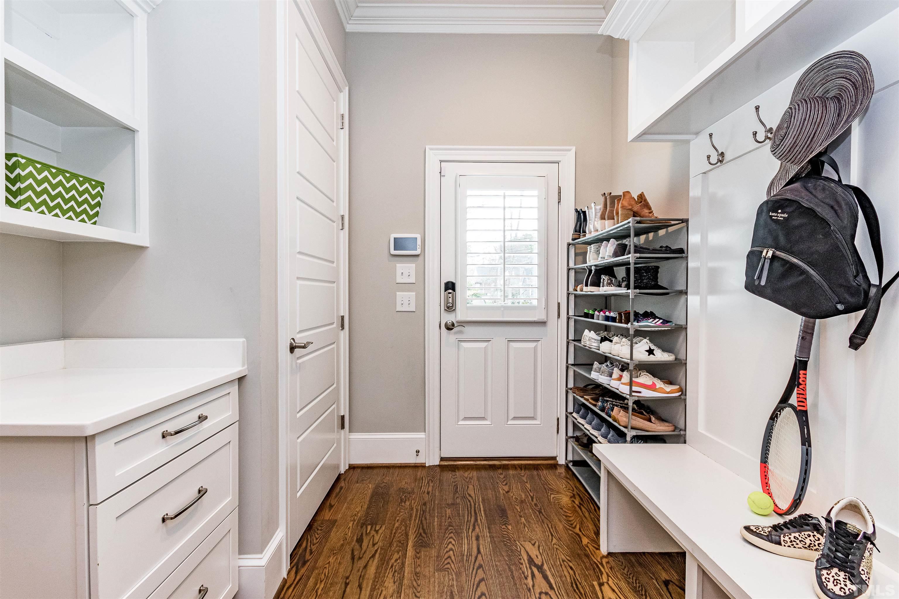 641 Cranbrook Road Raleigh, NC 27609 - Photo 17 of 39 a view of walk in closet with clothes and shoes