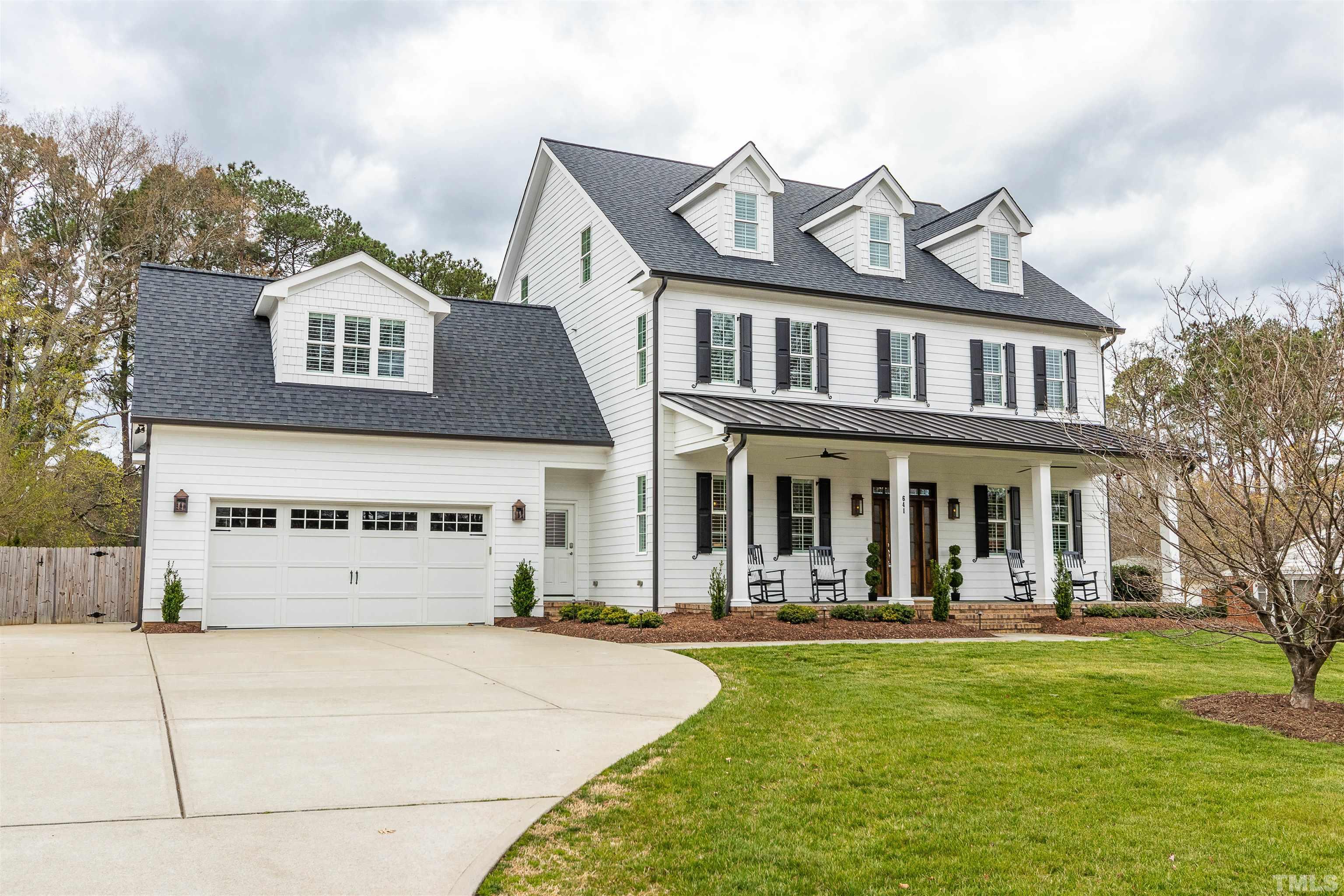 641 Cranbrook Road Raleigh, NC 27609 - Photo 2 of 39 a front view of a building with a yard