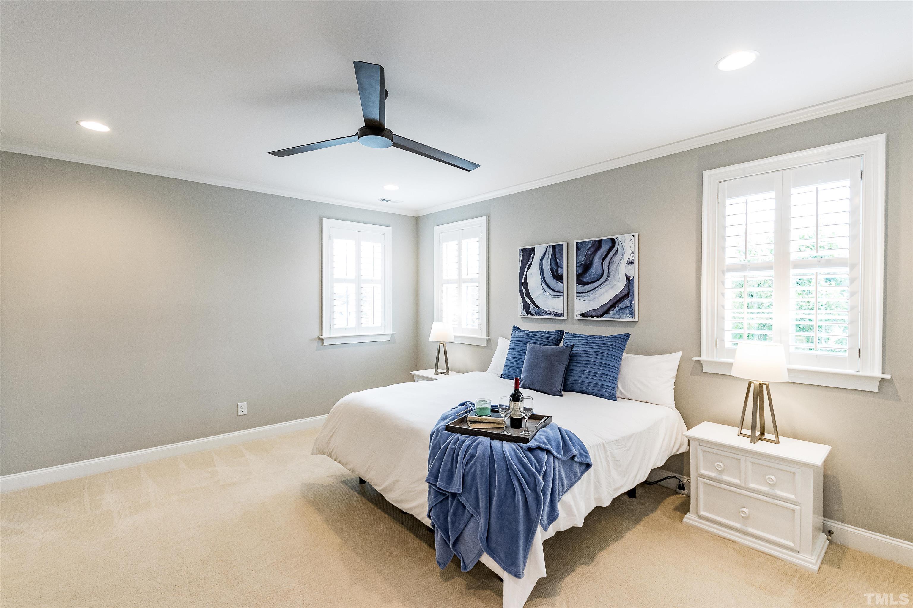 641 Cranbrook Road Raleigh, NC 27609 - Photo 21 of 39 a bedroom with a bed and a window