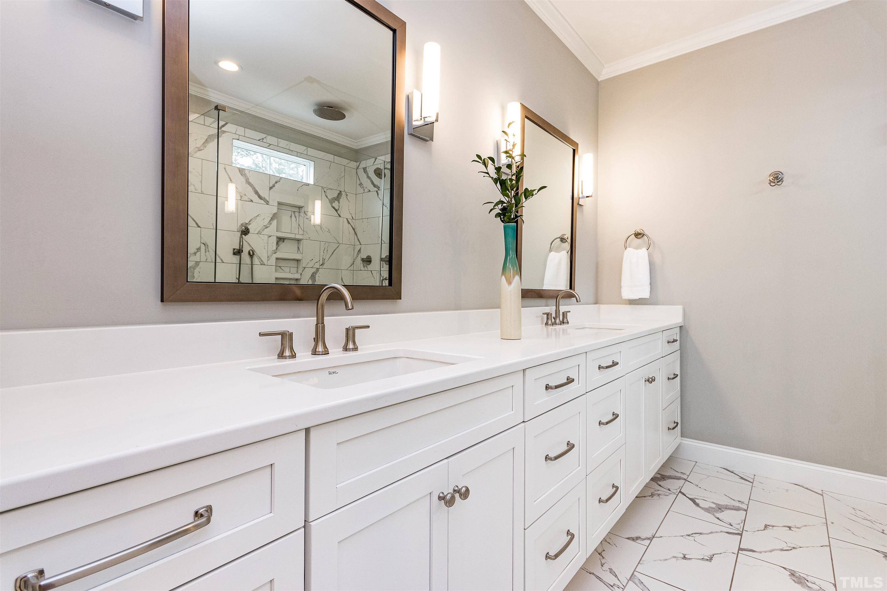 641 Cranbrook Road Raleigh, NC 27609 - Photo 24 of 39 a bathroom with double vanity sink and mirror