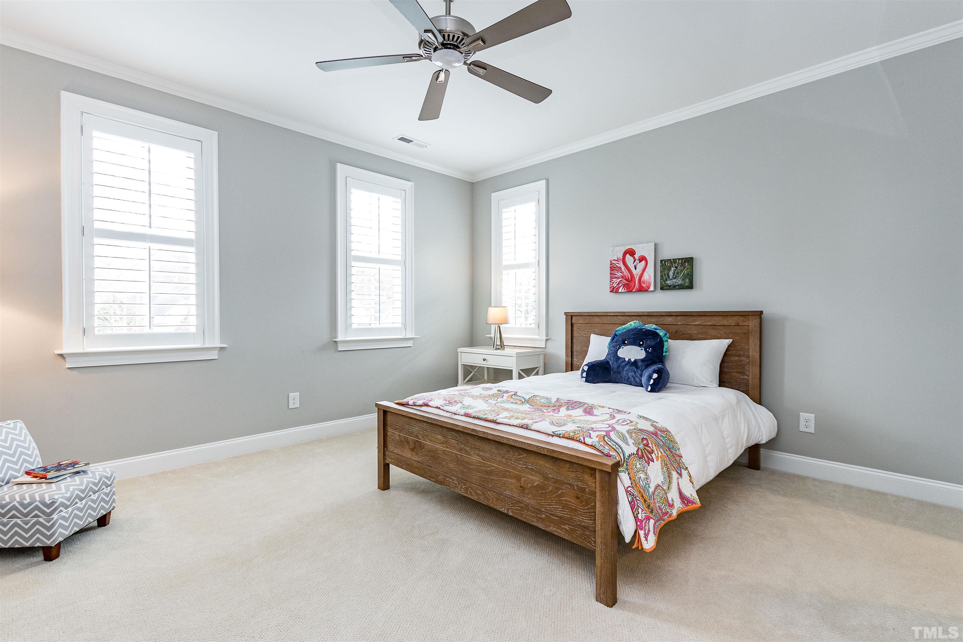 641 Cranbrook Road Raleigh, NC 27609 - Photo 26 of 39 a bedroom with a bed dresser and a window