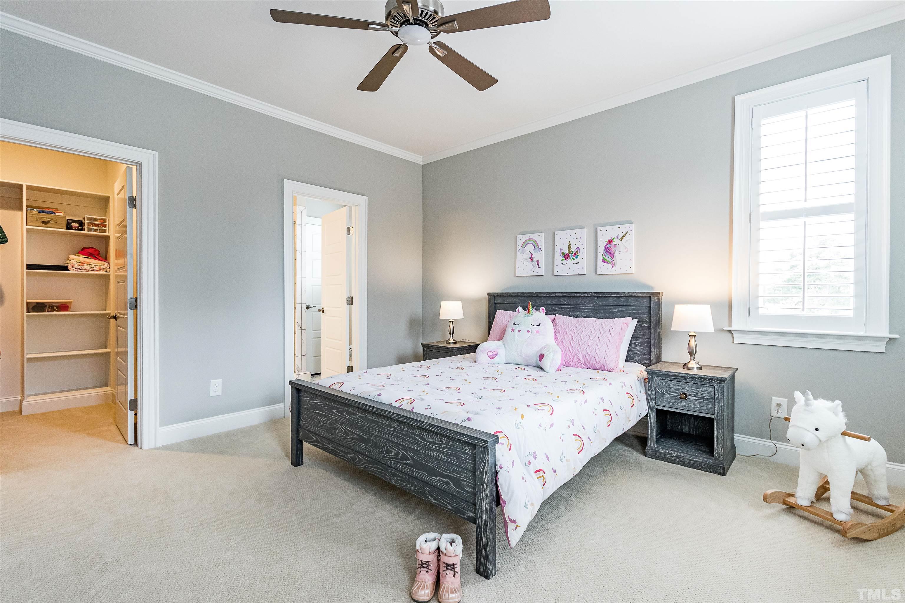 641 Cranbrook Road Raleigh, NC 27609 - Photo 27 of 39 a bedroom with a bed and cabinets