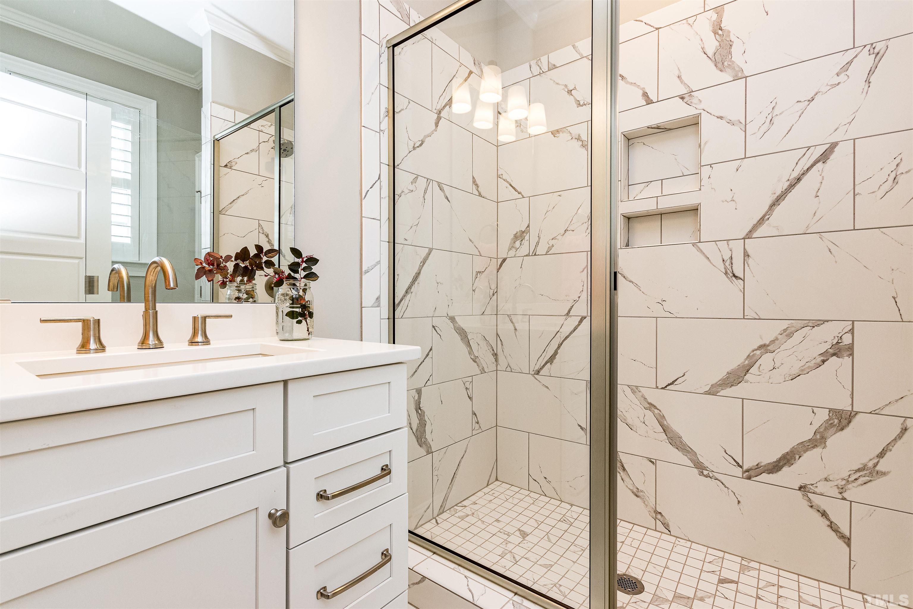 641 Cranbrook Road Raleigh, NC 27609 - Photo 28 of 39 a bathroom with a sink and mirror