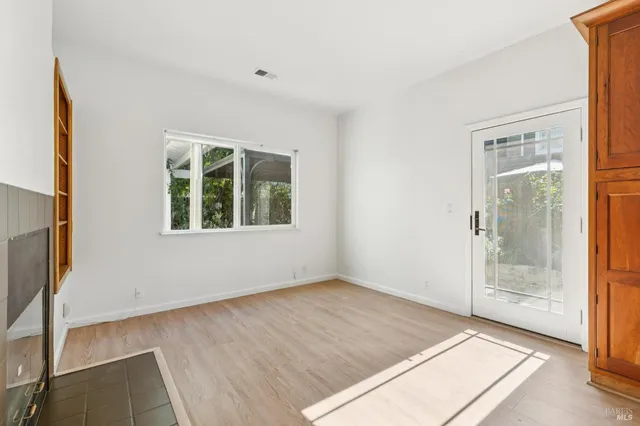 a kitchen with stainless steel appliances kitchen island granite countertop a refrigerator and a stove top oven