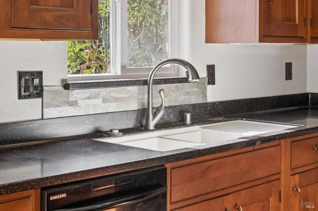 a bedroom with a bed and glass door