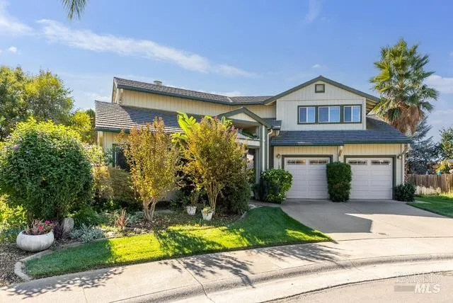 a front view of a house with garden