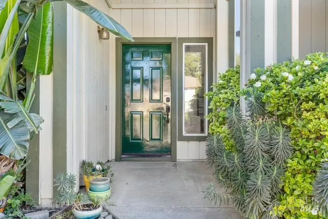a view of a hallway with dining area