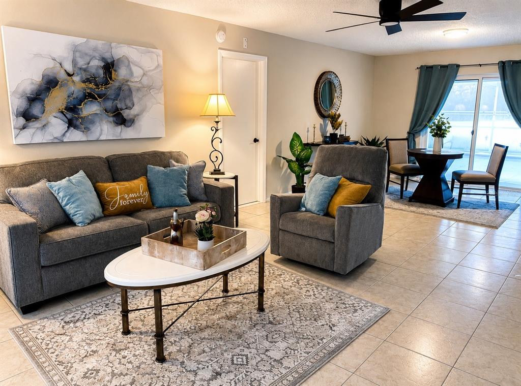 11177 Elgin Boulevard Spring Hill, FL 34608 - Photo 3 of 10 a living room with furniture and a large window