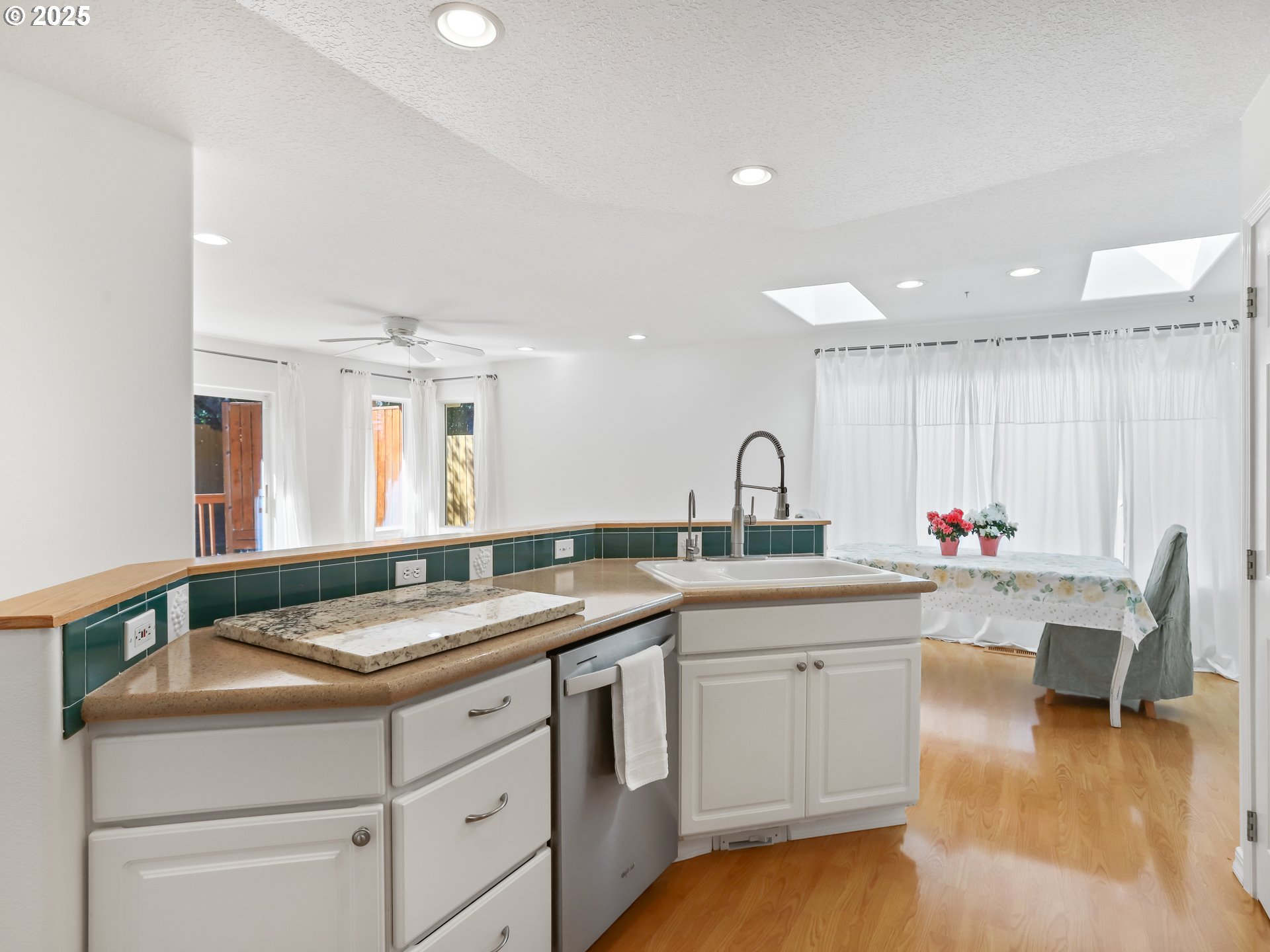 17265 Amber Lane Sandy, OR 97055 - Photo 15 of 46 a kitchen with a sink cabinets and wooden floor