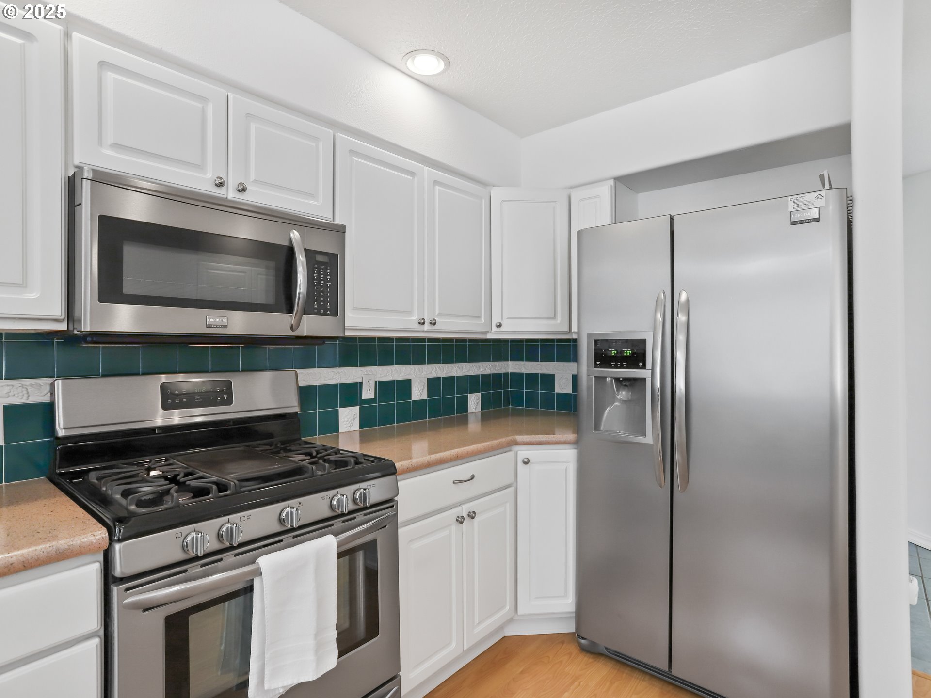 17265 Amber Lane Sandy, OR 97055 - Photo 17 of 46 a kitchen with stainless steel appliances granite countertop a stove a refrigerator and a microwave
