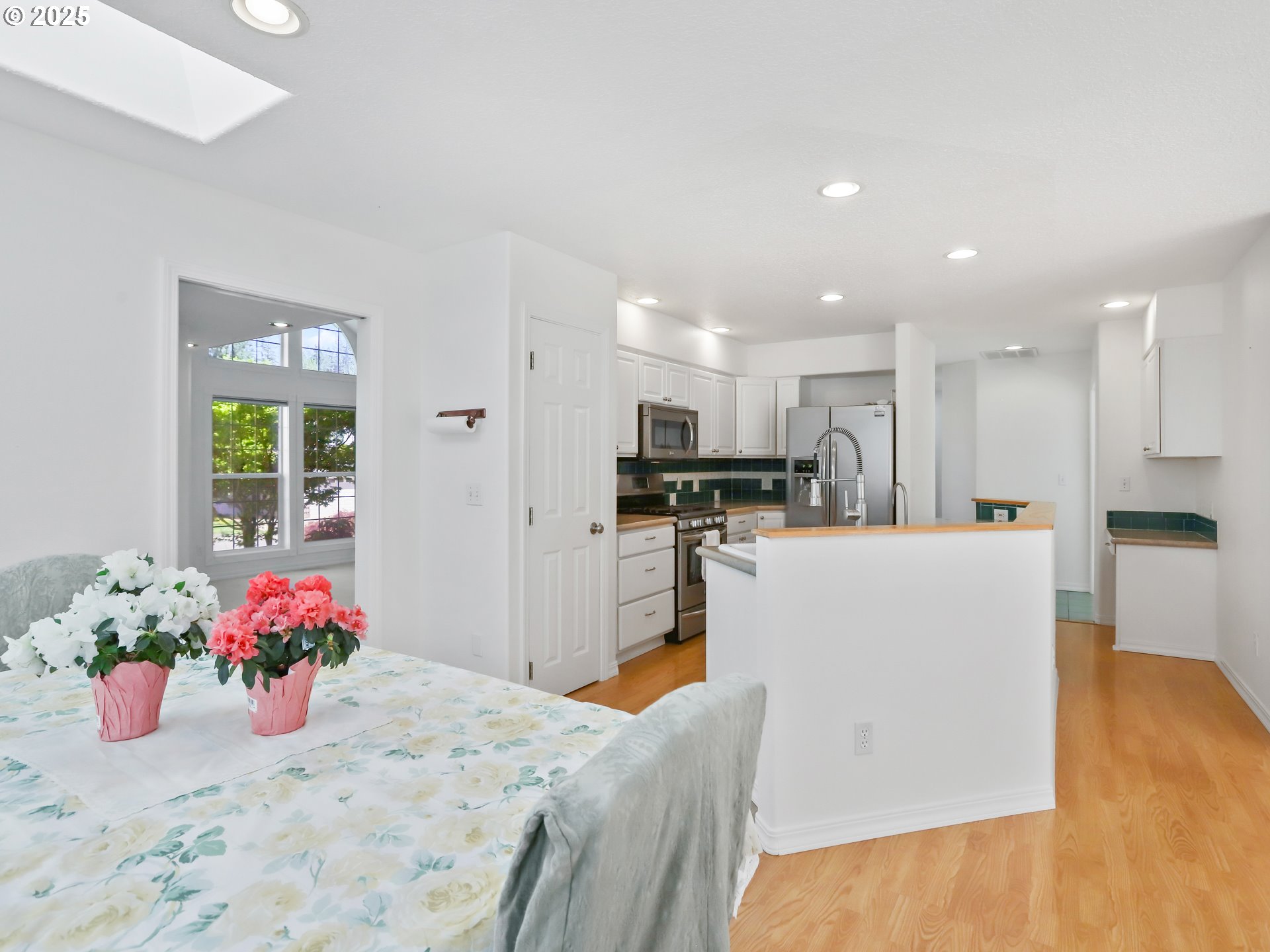 17265 Amber Lane Sandy, OR 97055 - Photo 19 of 46 a living room with kitchen island furniture and a kitchen view