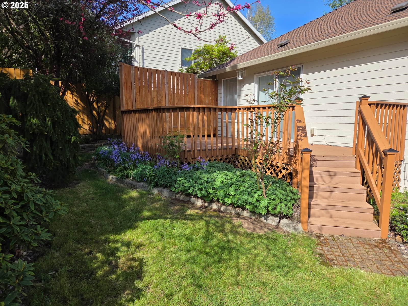17265 Amber Lane Sandy, OR 97055 - Photo 23 of 46 a view of a house with a yard and flower plants